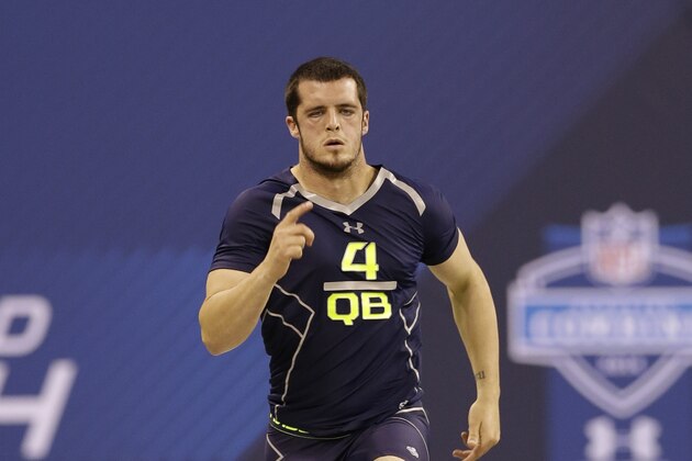 Fresno State quarterback Derek Carr runs a drill at the NFL football scouting combine in Indianapolis, Sunday, Feb. 23, 2014. (AP Photo/Nam Y. Huh)
