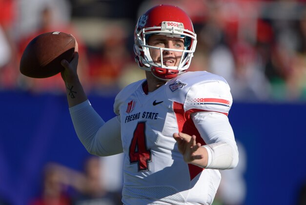 Dec 21, 2013; Las Vegas, NV, USA; Fresno State Bulldogs quarterback Derek Carr (4) throws a pass against the Southern California Trojans in the Las Vegas Bowl at Sam Boyd Stadium. Mandatory Credit: Kirby Lee-USA TODAY Sports
