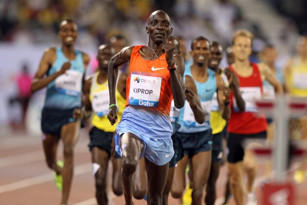 Kenya's Asbel Kiprop, centre, leads the men's 1500m final at the IAAF Diamond League in the Qatari capital Doha , Qatar, Friday May 10, 2013. (AP Photo/ Osama Faisal)