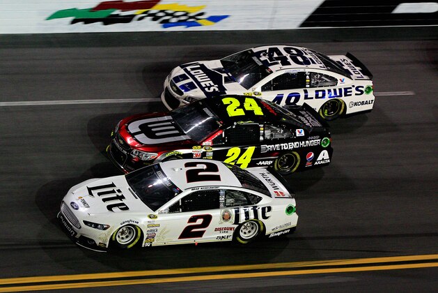 DAYTONA BEACH, FL - FEBRUARY 23:  Brad Keselowski, driver of the #2 Miller Lite Ford, leads Jeff Gordon, driver of the #24 Drive To End Hunger Chevrolet, and Jimmie Johnson, driver of the #48 Lowe's Chevrolet, during the NASCAR Sprint Cup Series Daytona 500 at Daytona International Speedway on February 23, 2014 in Daytona Beach, Florida.  (Photo by Sean Gardner/Getty Images)