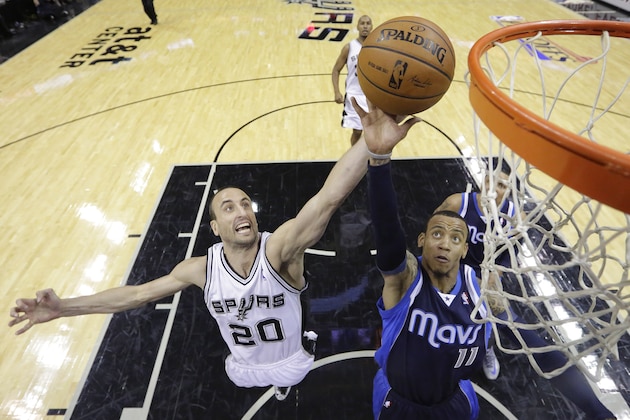 Dallas Mavericks' Monta Ellis (11) is defended by San Antonio Spurs' Manu Ginobili (20), of Argentina, while driving to the basket during the first half of Game 5 of the opening-round NBA basketball playoff series on Wednesday, April 30, 2014, in San Antonio. (AP Photo/Eric Gay)