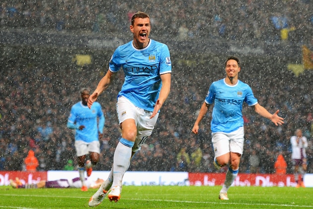 MANCHESTER, ENGLAND - MAY 07:  Edin Dzeko of Manchester City celebrates scoring the opening goal during the Barclays Premier League match between Manchester City and Aston Villa at Etihad Stadium on May 7, 2014 in Manchester, England.  (Photo by Michael Regan/Getty Images)