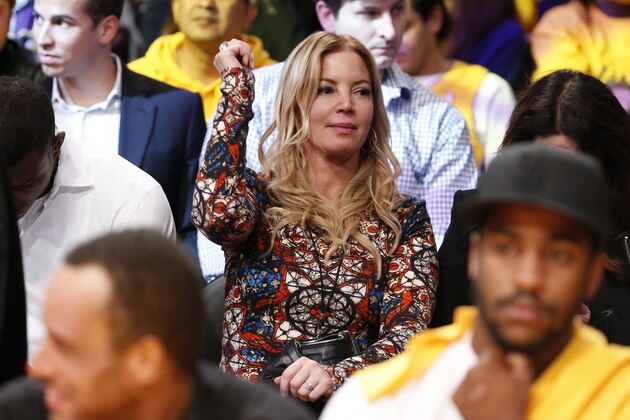 Los Angeles Lakers President Jeanie Buss dances in her seat to music as she attends the NBA basketball game between the Los Angeles Lakers and the Los Angeles Clippers during the second half in Los Angeles, Tuesday, Oct. 29, 2013. The Lakers won 116-103. (AP Photo/Danny Moloshok)