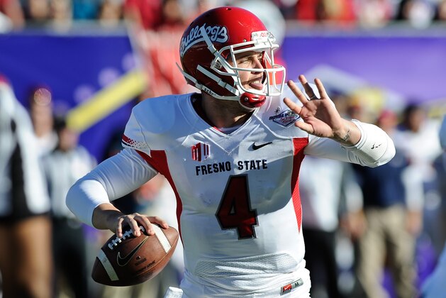 Fresno State quarterback Derek Carr looks to throw the ball against Southern California during the second quarter of the Royal Purple Bowl NCAA college football game, Saturday, Dec. 21, 2013, in Las Vegas. (AP Photo/David Cleveland)
