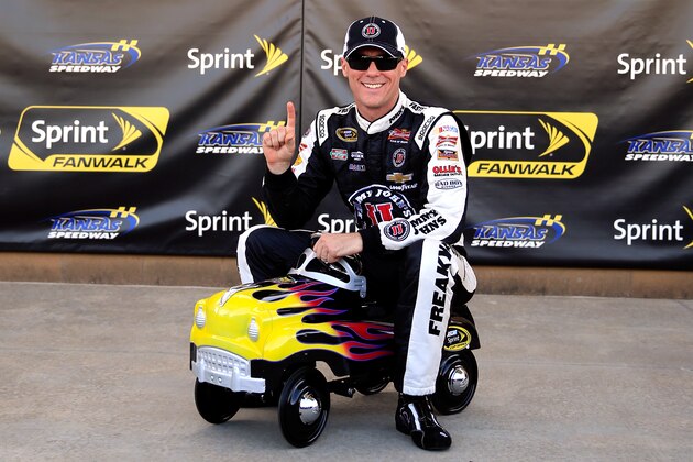 KANSAS CITY, KS - MAY 09: Kevin Harvick, driver of the #4 Jimmy John's Chevrolet, poses with the pole award after qualifying for the NASCAR Sprint Cup Series 5-Hour Energy 400 at Kansas Speedway on May 9, 2014 in Kansas City, Kansas.  (Photo by Jamie Squire/Getty Images)