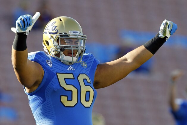 UCLA guard Xavier Su'a-Filo (56) warms up on the field prior to their NCCA college football game against Colorado Saturday, Nov. 2, 2013, in Pasadena, Calif. (AP Photo/Alex Gallardo)