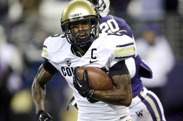 FILE - In this Nov. 9, 2013, file photo, Colorado's wide receiver Paul Richardson runs the ball for a touchdown after making a reception against Washington in the first half of an NCAA college football game in Seattle. The Seattle Seahawks picked Colorado wide receiver Richardson with the No. 45 overall pick in the second round of the NFL draft Friday, May 9, 2014. (AP Photo/Ted S. Warren, File)
