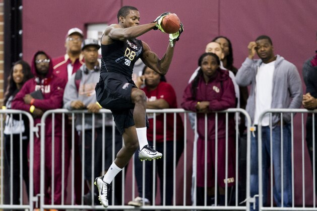 Defensive back Lamarcus Joyner jumps for a catch during NFL football Pro Day at Florida State University on Tuesday, March 18, 2014, in Tallahassee, Fla. (AP Photo/Colin Hackley)