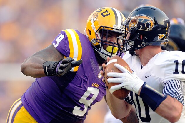 BATON ROUGE, LA - SEPTEMBER 14:  Ego Ferguson #9 of the LSU Tigers sacks Colin Reardon #10 of the Kent State Golden Flashes during a game at Tiger Stadium on September 14, 2013 in Baton Rouge, Louisiana.  (Photo by Stacy Revere/Getty Images)
