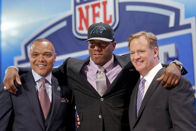 Missouri defensive end Kony Ealy poses for photos with NFL commissioner Roger Goodell  and Mark Carrier after being selected as the 60th pick by the Carolina Panthers in the second round of the 2014 NFL Draft, Friday, May 9, 2014, in New York. (AP Photo/Jason DeCrow)