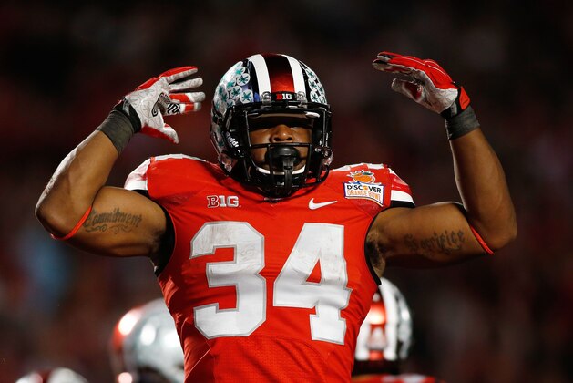 Jan 3, 2014; Miami Gardens, FL, USA; Ohio State Buckeyes running back Carlos Hyde (34) reacts against the Clemson Tigers in the second half of the 2014 Orange Bowl college football game at Sun Life Stadium. Mandatory Credit: Robert Mayer-USA TODAY Sports