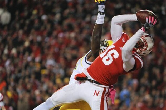 Nebraska's Stanley Jean-Baptiste (16) grabs a pass intended for Michigan's Devin Gardner (12) in the fourth quarter of an NCAA college football game Saturday, Oct. 27, 2012, in Lincoln, Neb. (AP Photo/Dave Weaver)