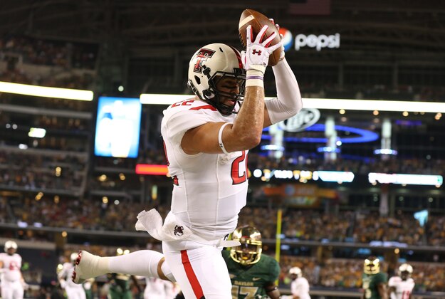 Nov 16, 2013; Arlington, TX, USA; Texas Tech Red Raiders tight end Jace Amaro (22) catches a touchdown pass in the first quarter against the Baylor Bears at AT&T Stadium. Mandatory Credit: Matthew Emmons-USA TODAY Sports