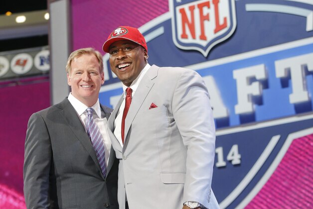 USC center Marcus Martin poses for photos with NFL commissioner Roger Goodell after being selected as the 70th pick by the San Francisco 49ers in the third round of the 2014 NFL Draft, Friday, May 9, 2014, in New York. (AP Photo/Jason DeCrow)