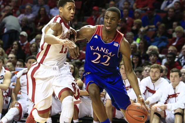 Kansas guard Andrew Wiggins, right, drives around Oklahoma guard Isaiah Cousins, left, during the first half of an NCAA college basketball game in Norman, Okla., Wednesday, Jan. 8, 2014. (AP Photo/Alonzo Adams) Kansas guard Andrew Wiggins, right, drives around Oklahoma guard Isaiah Cousins, left, during the first half of an NCAA college basketball game in Norman, Okla., Wednesday, Jan. 8, 2014. (AP Photo/Alonzo Adams)