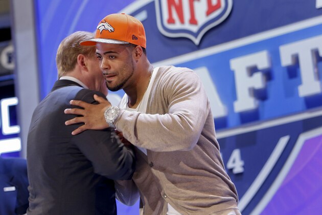 Indiana wide receiver Cody Latimer greets NFL commissioner Roger Goodell after being selected by the Denver Broncos as the 56th pick during the second round of the 2014 NFL Draft, Friday, May 9, 2014, in New York. (AP Photo/Jason DeCrow)