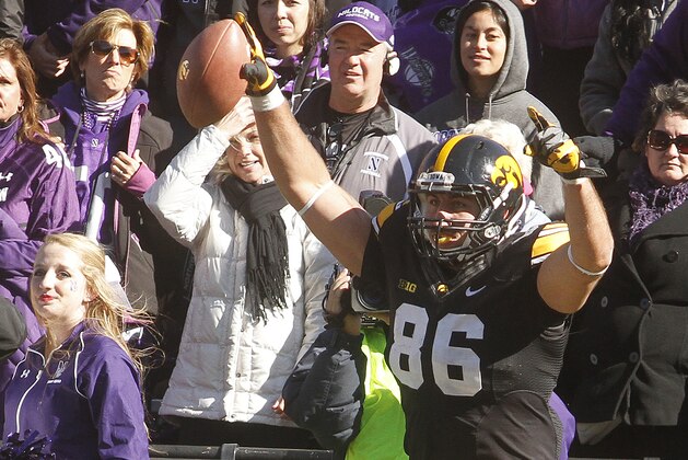 IOWA CITY, IOWA - OCTOBER 26:  Tight end C.J. Fiedorowicz #86  of the Iowa Hawkeyes celebrates after scoring a touchdown during overtime against the Northwestern Wildcats on October 26, 2013 at Kinnick Stadium in Iowa City, Iowa. Iowa won 17-10. (Photo by Matthew Holst/Getty Images)
