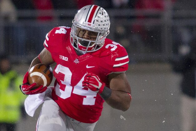 Nov 23, 2013; Columbus, OH, USA;  Ohio State Buckeyes running back Carlos Hyde (34) runs the ball in the third quarter of the game against the Indiana Hoosiers at Ohio Stadium. Ohio State Buckeyes beat Indiana Hoosiers 42-14. Mandatory Credit: Trevor Ruszkowksi-USA TODAY Sports