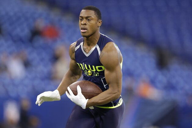 Penn State wide receiver Allen Robinson makes a catch during a drill at the NFL football scouting combine in Indianapolis, Sunday, Feb. 23, 2014. (AP Photo/Michael Conroy)