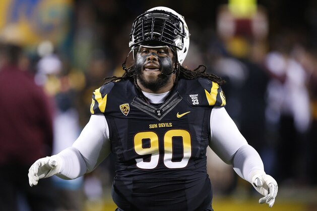 Arizona State's Will Sutton runs onto the field as he is introduced on senior night prior to an NCAA college football game against Arizona Saturday, Nov. 30, 2013, in Tempe, Ariz. (AP Photo/Ross D. Franklin)