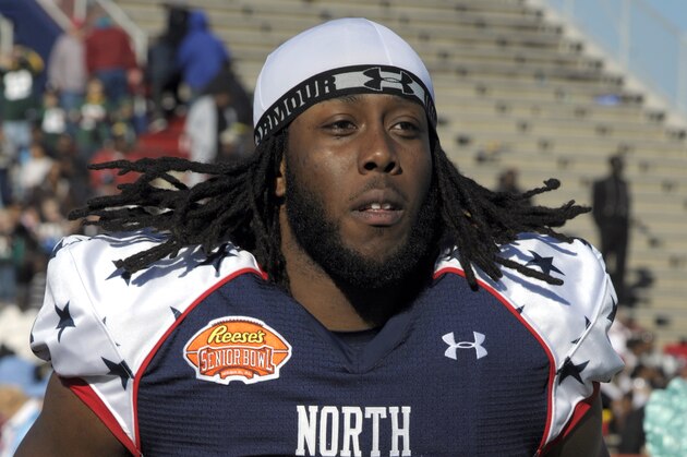North defensive tackle Will Clarke (94) of West Virginia runs on to the field before the Senior Bowl NCAA college football game on Saturday, Jan. 25, 2014, in Mobile, Ala. (AP Photo/G.M. Andrews)