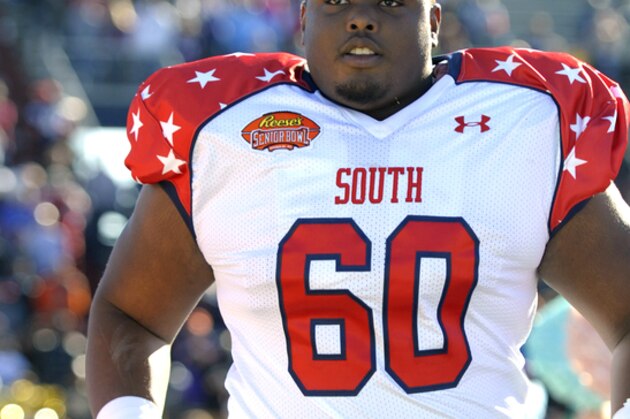 South offensive guard Gabe Jackson (60) of Mississippi State runs on to the field before the Senior Bowl NCAA college football game on Saturday, Jan. 25, 2014, in Mobile, Ala. (AP Photo/G.M. Andrews)