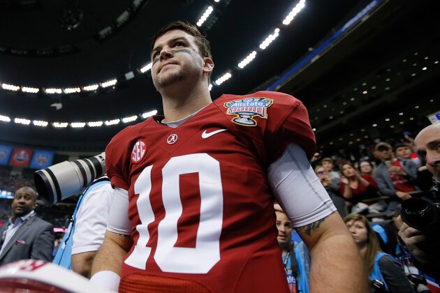 NEW ORLEANS, LA - JANUARY 02:  AJ McCarron #10 of the Alabama Crimson Tide walks off the field after the Allstate Sugar Bowl at the Mercedes-Benz Superdome on January 2, 2014 in New Orleans, Louisiana. The Sooners defeated the Crimson Tide 45-31.  (Photo by Kevin C. Cox/Getty Images)