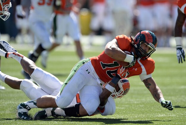 Sep 28, 2013; Fort Collins, CO, USA; Colorado State Rams tight end Crockett Gillmore (10) is tackled after a reception by UTEP Miners defensive back Jameel Erving (22) in the first quarter at Hughes Stadium. Mandatory Credit: Ron Chenoy-USA TODAY Sports
