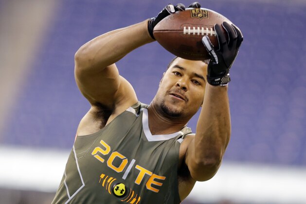 California tight end Richard Rodgers makes a catch as he runs a drill during the NFL football scouting combine in Indianapolis, Saturday, Feb. 22, 2014. (AP Photo/Michael Conroy)