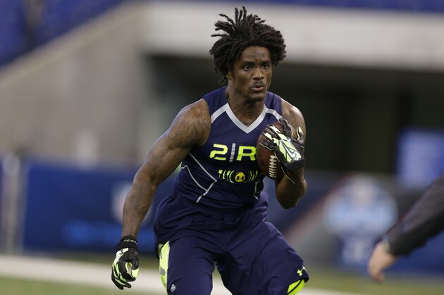 Kent State running back Dri Archer runs a drill at the NFL football scouting combine in Indianapolis, Sunday, Feb. 23, 2014. (AP Photo/Michael Conroy)