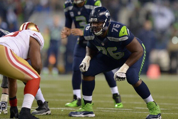 Jan 19, 2014; Seattle, WA, USA; Seattle Seahawks tackle Russell Okung (76) during the second half of the 2013 NFC Championship football game against the San Francisco 49ers at CenturyLink Field. The Seahawks defeated the 49ers 23-17 to advance to Super Bowl XLVIII. Mandatory Credit: Kirby Lee-USA TODAY Sports