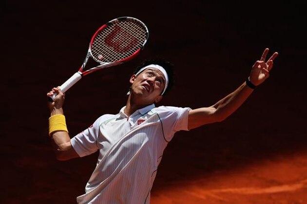 Kei Nishikori from Japan reacts after losing a point during a Madrid Open tennis tournament match against Feliciano Lopez from Spain in Madrid, Spain, Friday, May 9, 2014. (AP Photo/Andres Kudacki)
