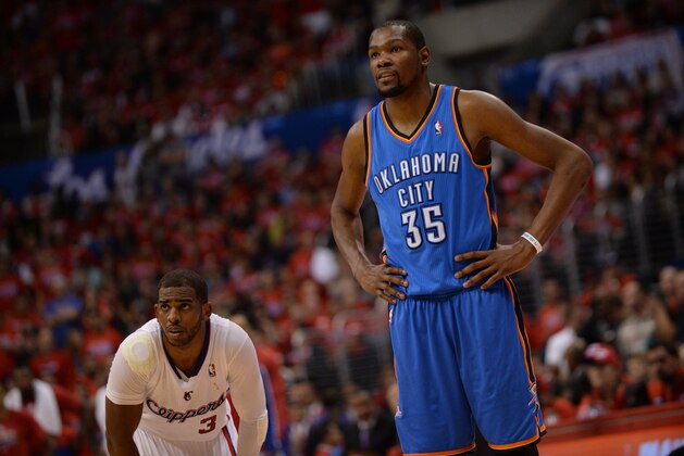 LOS ANGELES, CA - MAY 9: Chris Paul #3 of the Los Angeles Clippers stands on the court during a game against Kevin Durant #35 of the Oklahoma City Thunder look on in Game Three of the Western Conference Semifinals during the 2014 NBA Playoffs at Staples Center on May 9, 2014 in Los Angeles, California. NOTE TO USER: User expressly acknowledges and agrees that, by downloading and/or using this Photograph, user is consenting to the terms and conditions of the Getty Images License Agreement. Mandatory Copyright Notice: Copyright 2014 NBAE (Photo by Noah Graham/NBAE via Getty Images)
