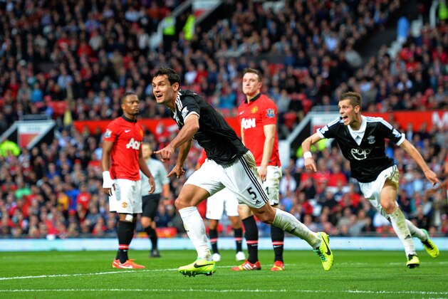 MANCHESTER, ENGLAND - OCTOBER 19:  Dejan Lovren of Southampton celebrates after scoring a late goal to level the scores at 1-1 during the Barclays Premier League match between Manchester United and Southampton at Old Trafford on October 19, 2013 in Manchester, England.  (Photo by Shaun Botterill/Getty Images)