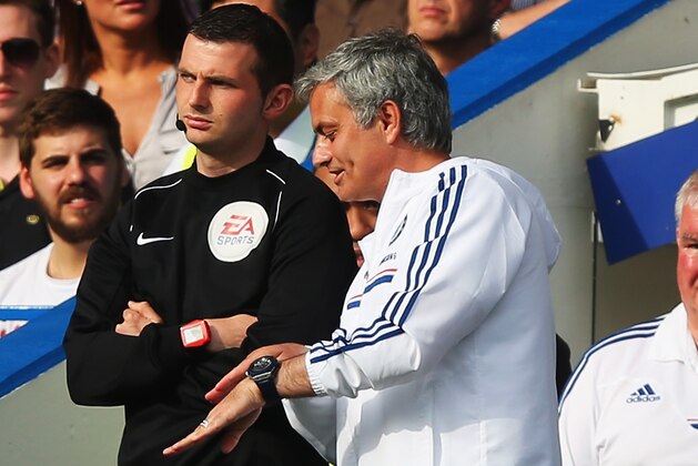 LONDON, ENGLAND - MAY 04:  Chelsea manager Jose Mourinho talks to the fourth official on the touchline during the Barclays Premier League match between Chelsea and Norwich City at Stamford Bridge on May 4, 2014 in London, England.  (Photo by Clive Rose/Getty Images)