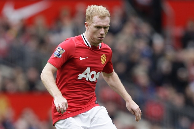 Manchester United's Paul Scholes during his team's  English Premier League soccer match against Queens Park Rangers at Old Trafford Stadium, Manchester, England, Sunday, April 8, 2012. (AP Photo/Jon Super)