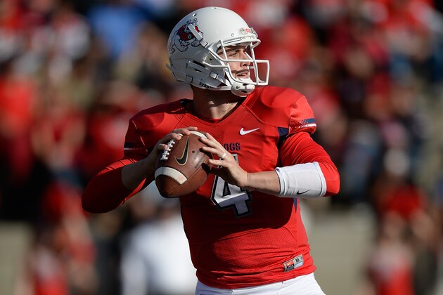 FRESNO, CA - NOVEMBER 23:  Derek Carr #4 of the Fresno State Bulldogs drops back to pass against the New Mexico Lobos during the second quarter at Bulldog Stadium on November 23, 2013 in Fresno, California.  (Photo by Thearon W. Henderson/Getty Images)