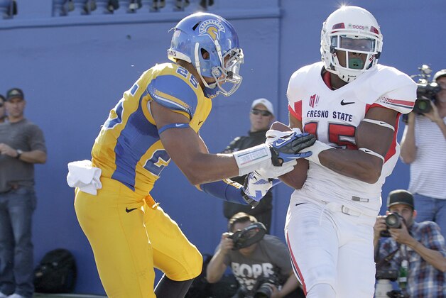 Fresno State wide receiver Davante Adams (15) catches a touchdown pass against San Jose State cornerback Akeem King (25) during the first half of an NCAA college football game on Friday, Nov. 29, 2013, in San Jose, Calif. (AP Photo/Tony Avelar)