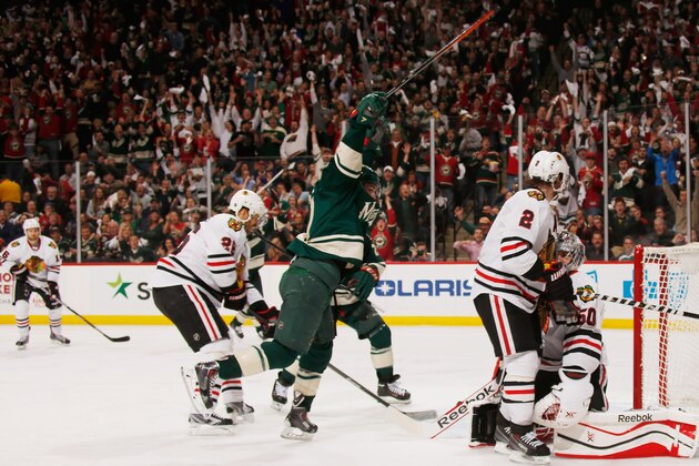 ST. PAUL, MN - MAY 9: Zach Parise #11 celebrates after his Minnesota Wild teammate Jared Spurgeon #46 scores a goal against the Chicago Blackhawks Game Four of the Second Round of the 2014 Stanley Cup Playoffs on May 9, 2014 at the Xcel Energy Center in St. Paul, Minnesota. (Photo by Bruce Kluckhohn/NHLI via Getty Images)