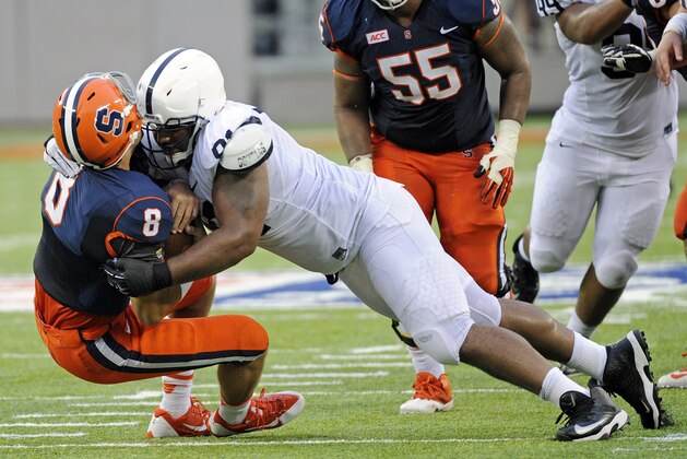 Syracuse quarterback Drew Allen (8) is sacked by Penn State defensive tackle  DaQuan Jones during the fourth quarter of an NCAA college football game Saturday, Aug. 31, 2013, in East Rutherford, N.J. Penn State won 23-17. (AP Photo/Bill Kostroun)