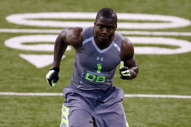 Utah State defensive back Maurice Alexander runs a drill at the NFL football scouting combine in Indianapolis, Tuesday, Feb. 25, 2014. (AP Photo/Michael Conroy)