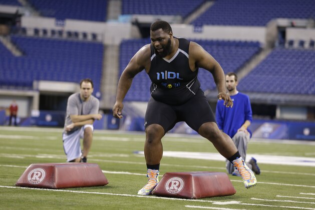 Louisiana Tech defensive lineman Justin Ellis runs a drill at the NFL football scouting combine in Indianapolis, Monday, Feb. 24, 2014. (AP Photo/Michael Conroy)