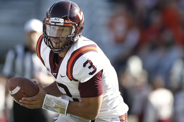 Virginia Tech quarterback Logan Thomas looks to run against Boston College during the first half of a college football game at Alumni Stadium in Boston, Saturday, Nov. 2, 2013. (AP Photo/Winslow Townson)