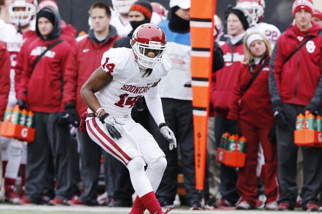 defensive back Aaron Colvin (14) is pictured during an NCAA college football game between Oklahoma State and Oklahoma in Stillwater, Okla., Saturday, Dec. 7, 2013. (AP Photo/Sue Ogrocki)