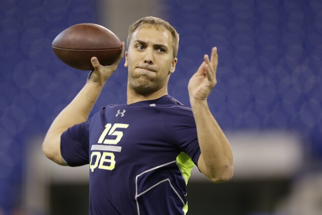 Pittsburgh quarterback Tom Savage throws during a drill at the NFL football scouting combine in Indianapolis, Sunday, Feb. 23, 2014. (AP Photo/Michael Conroy)
