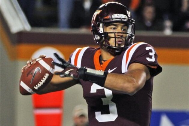Virginia Tech quarterback Logan Thomas looks for a receiver during the first half of an NCAA college football game against Florida State in Blacksburg, Va., Thursday, Nov. 8, 2012. (AP Photo/Steve Helber)