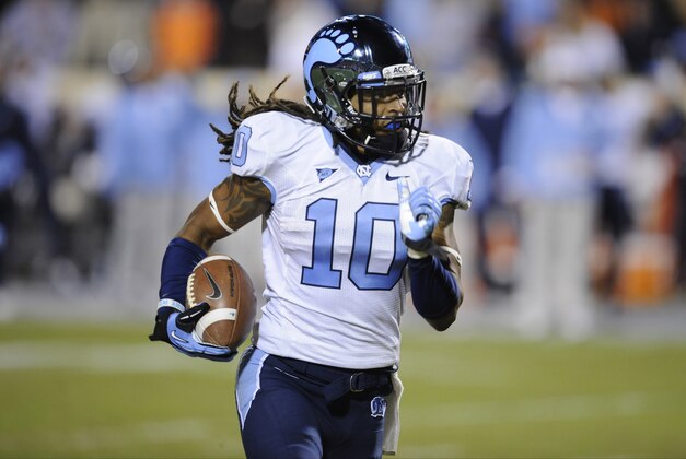 Nov 15, 2012; Charlottesville, VA, USA; North Carolina Tar Heels safety Tre Boston (10) returns an interception back for a touchdown against the Virginia Cavaliers during the first half at Scott Stadium.  Mandatory Credit: Rafael Suanes-USA TODAY Sports