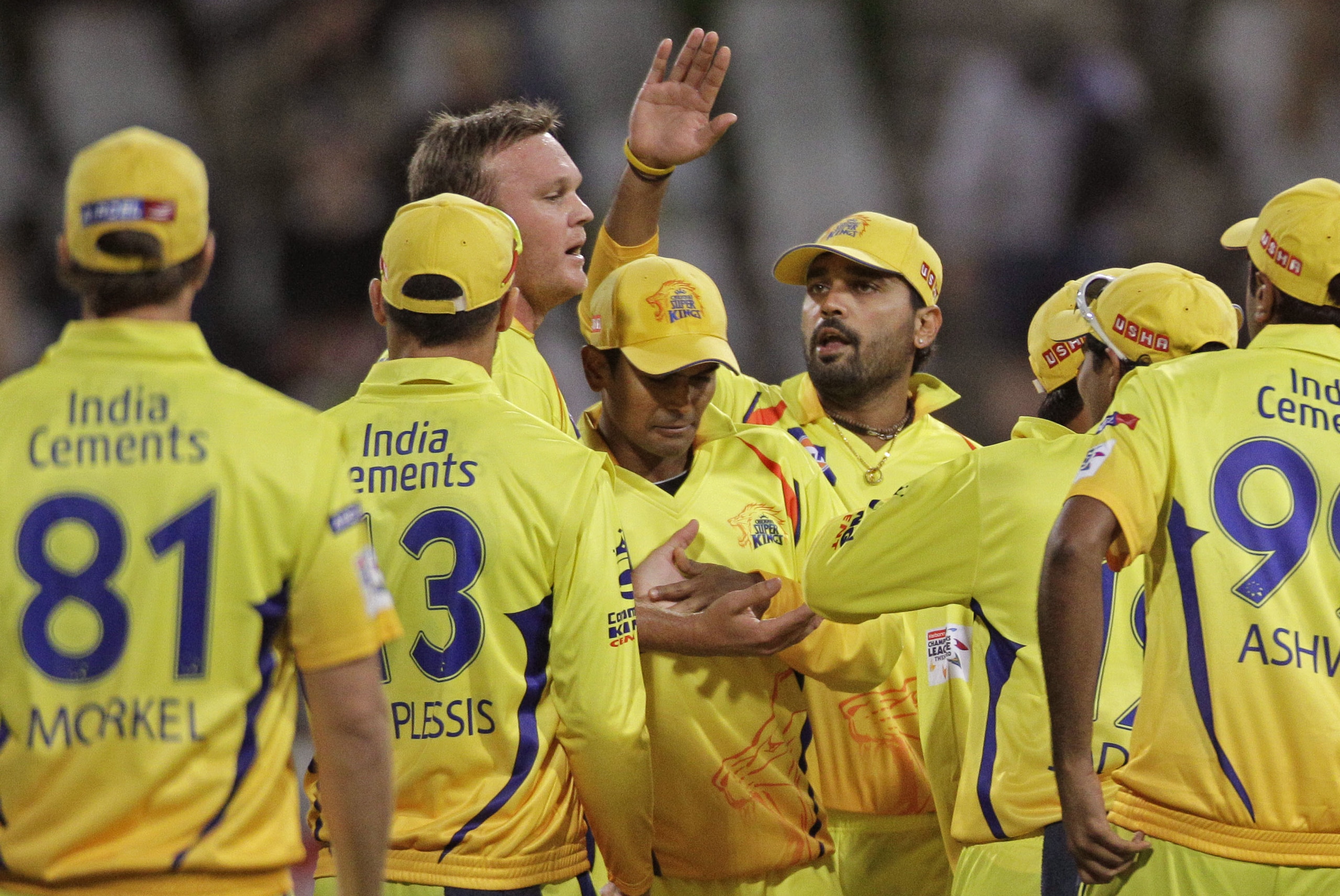 Chennai Super Kings Faf du Plessis, second left, reacts with team members as they take the wicket of Highveld Lions' Quinton de Kock, unseen, during a Champions League Twenty20 in Cape Town, South Africa, Tuesday, Oct 16, 2012. (AP Photo/Schalk van Zuydam)