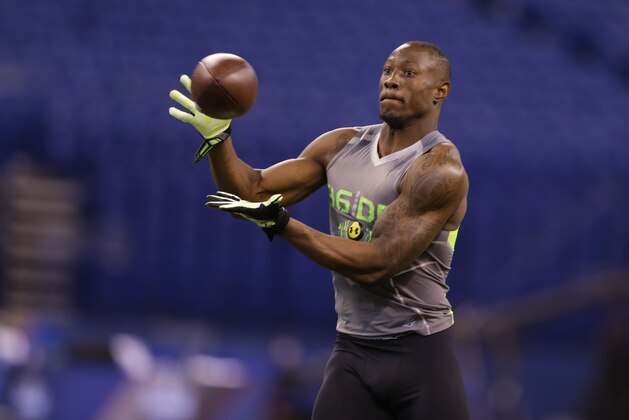 Utah State defensive back Nevin Lawson runs a drill at the NFL football scouting combine in Indianapolis, Tuesday, Feb. 25, 2014. (AP Photo/Michael Conroy)