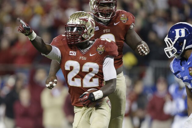 Florida State's Telvin Smith (22) celebrates his fumble recovery against Duke in the second half of the Atlantic Coast Conference Championship NCAA football game in Charlotte, N.C., Saturday, Dec. 7, 2013. (AP Photo/Bob Leverone)
